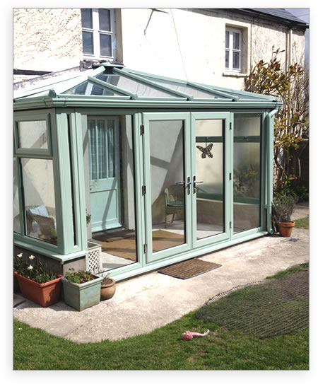 Chartwell green uPVC conservatory with french doors