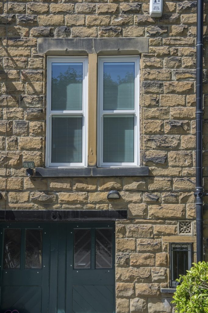 Sliding sash window with integral blinds