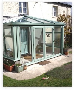 Chartwell green uPVC conservatory with french doors